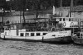 Tourist boat floats on the channel near Notre Dame de Paris. Royalty Free Stock Photo